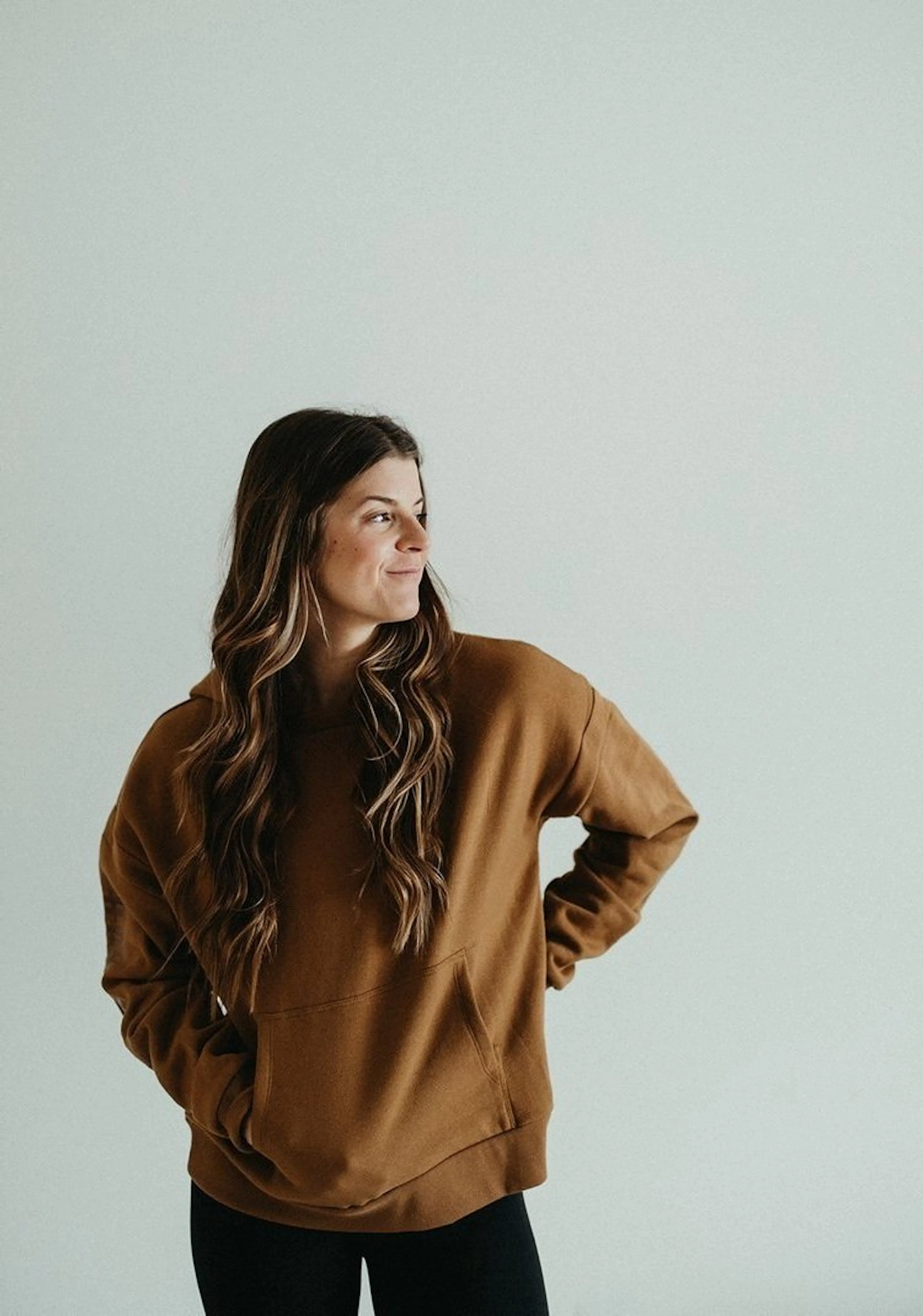 Cassidy Wendell in a brown hoodie against a plain wall