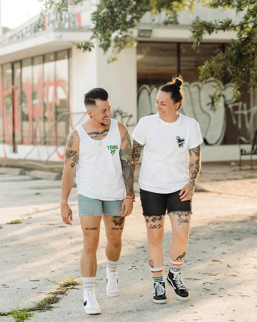 Chris Rhodes and a friend walking down a street