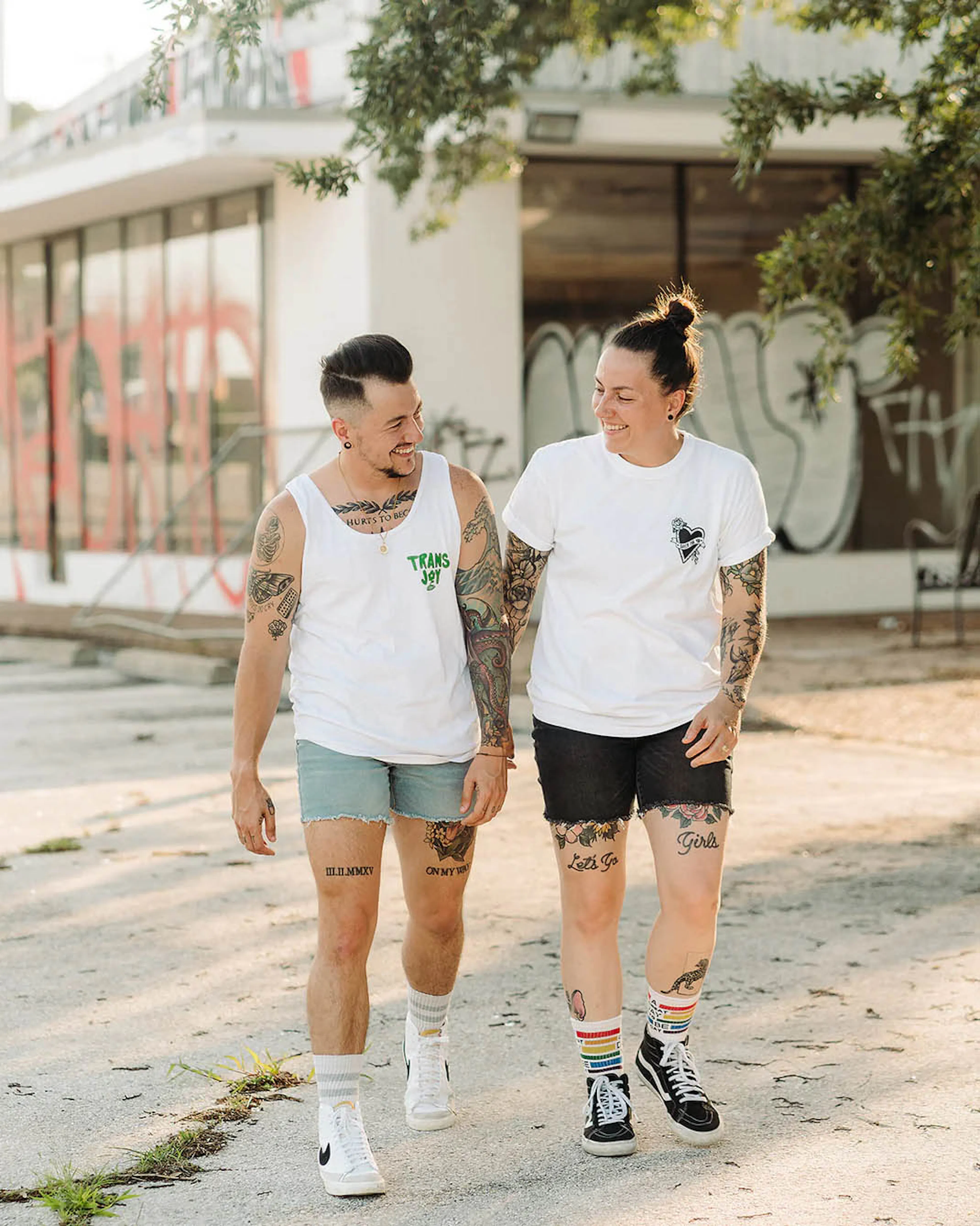 Chris Rhodes and a friend walking down a street