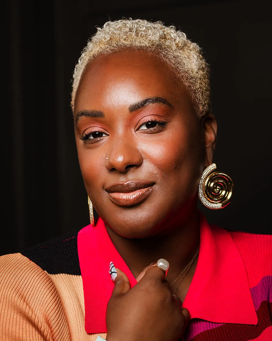 A close portrait of Gabriella Layne-Avery wearing gold hoop earrings