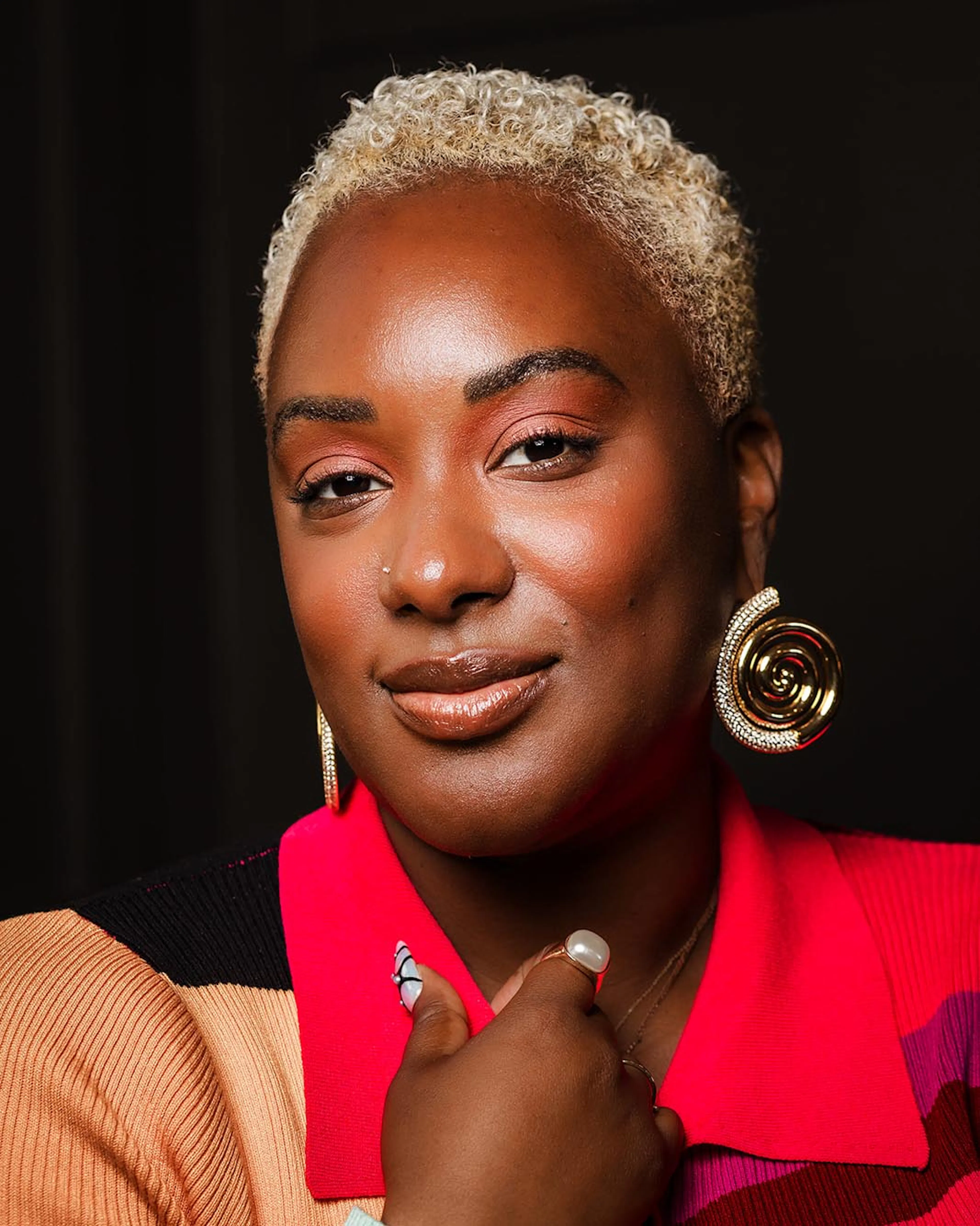 A close portrait of Gabriella Layne-Avery wearing gold hoop earrings