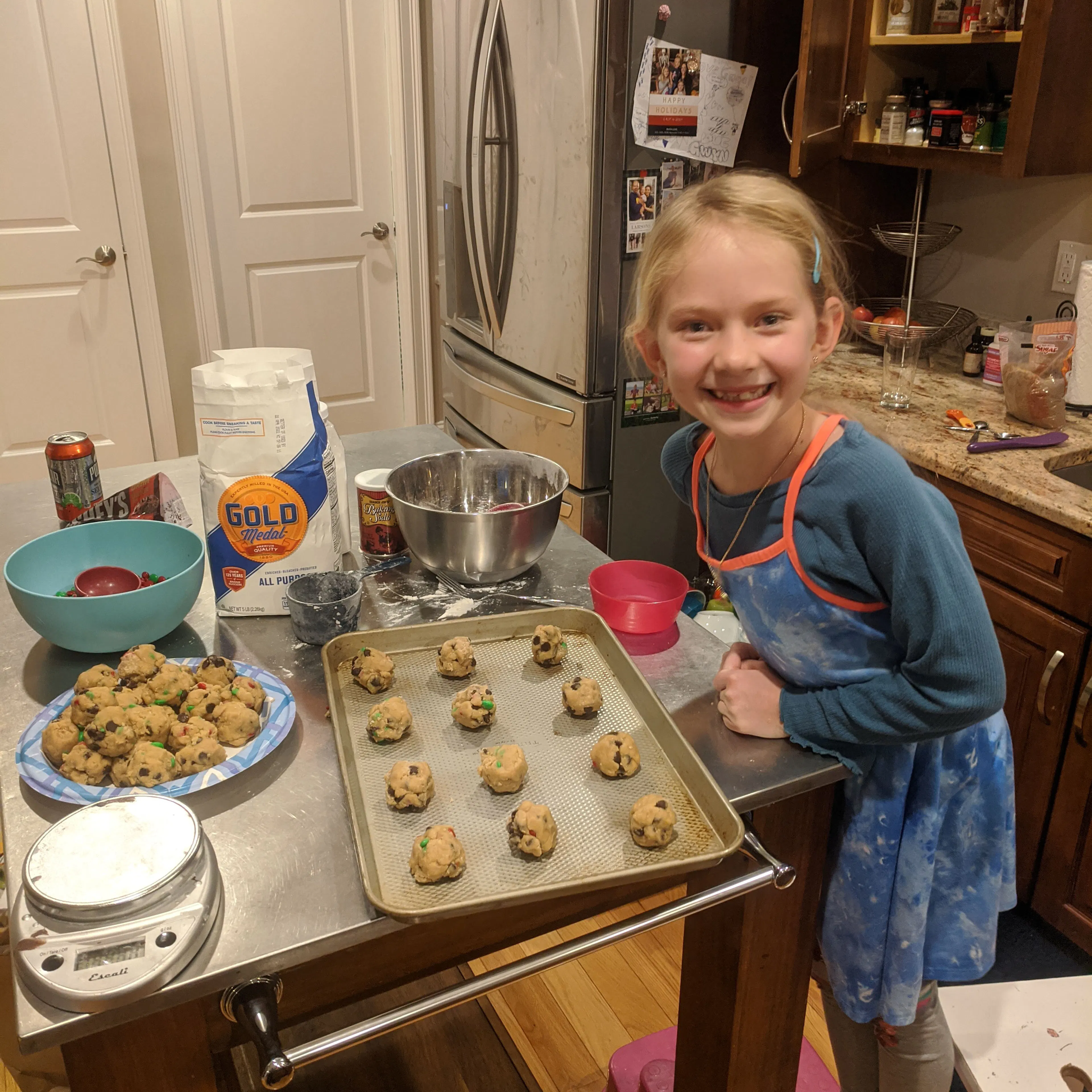 A girl baking cookies in a home kitchen