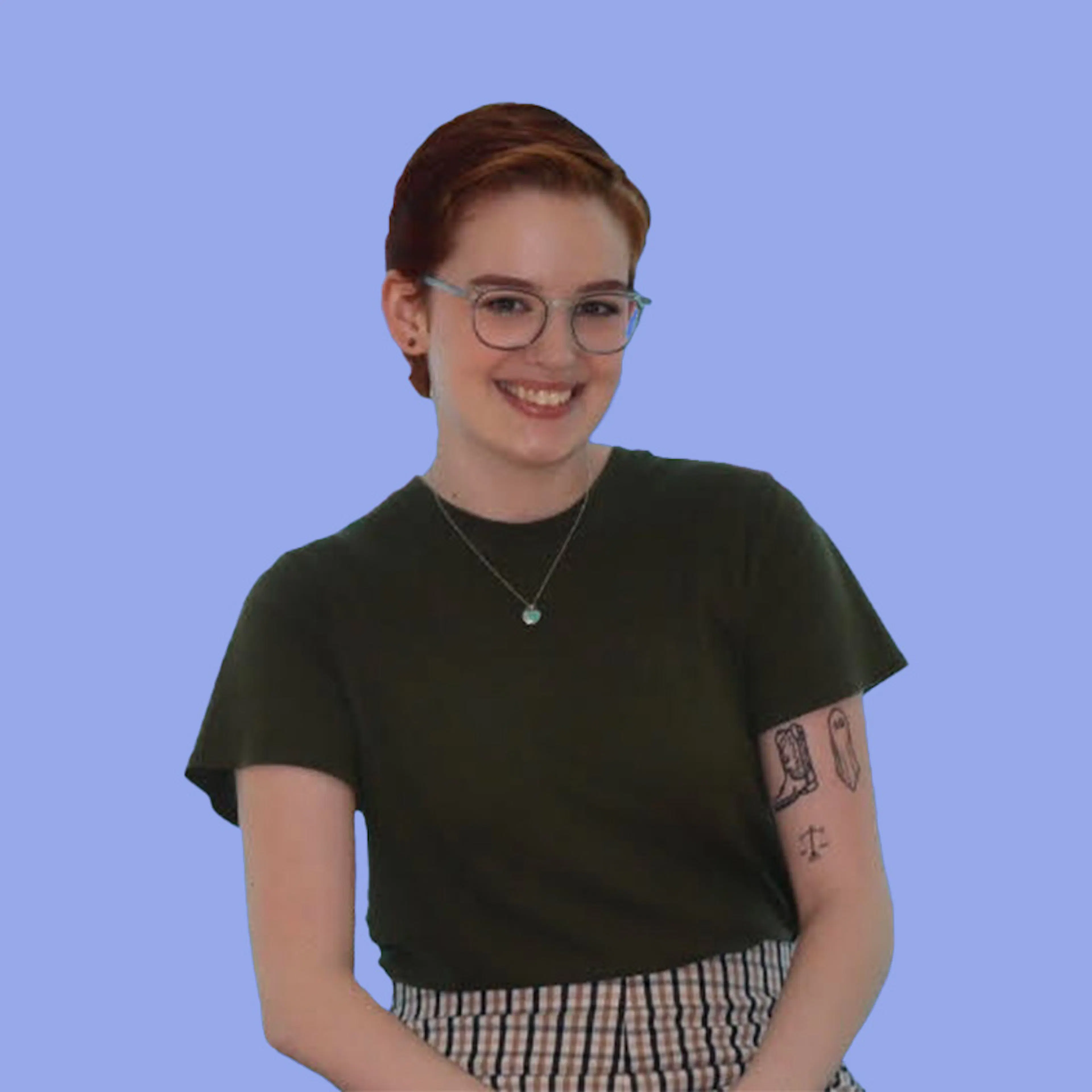 A smiling team member in glasses and a black T-shirt